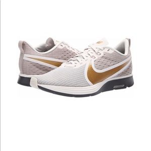 nike zoom strike 2 gold